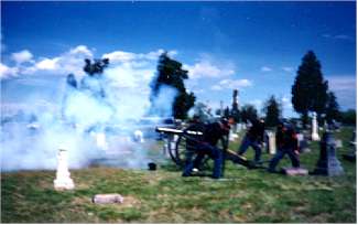 The air is filled with smoke from the canon
