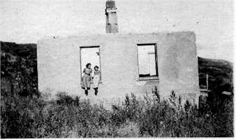 My mother and I in the window of the house where she once lived